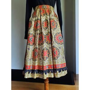 Vintage 1960's handmade skirt. Gorgeous bold pattern and crochet pom pom trim.